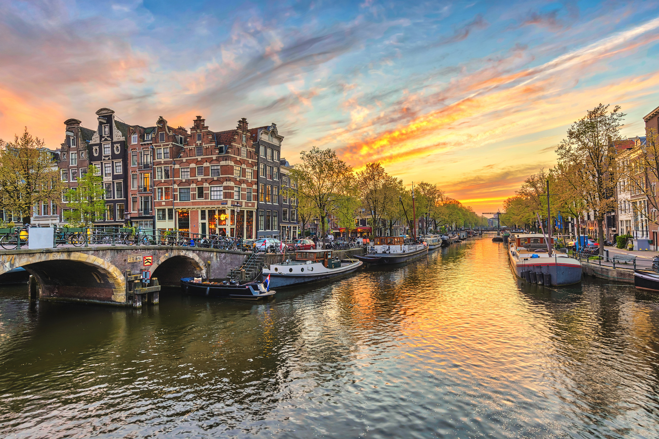 Image of Amsterdam Sunset City Skyline At Canal Waterfront
