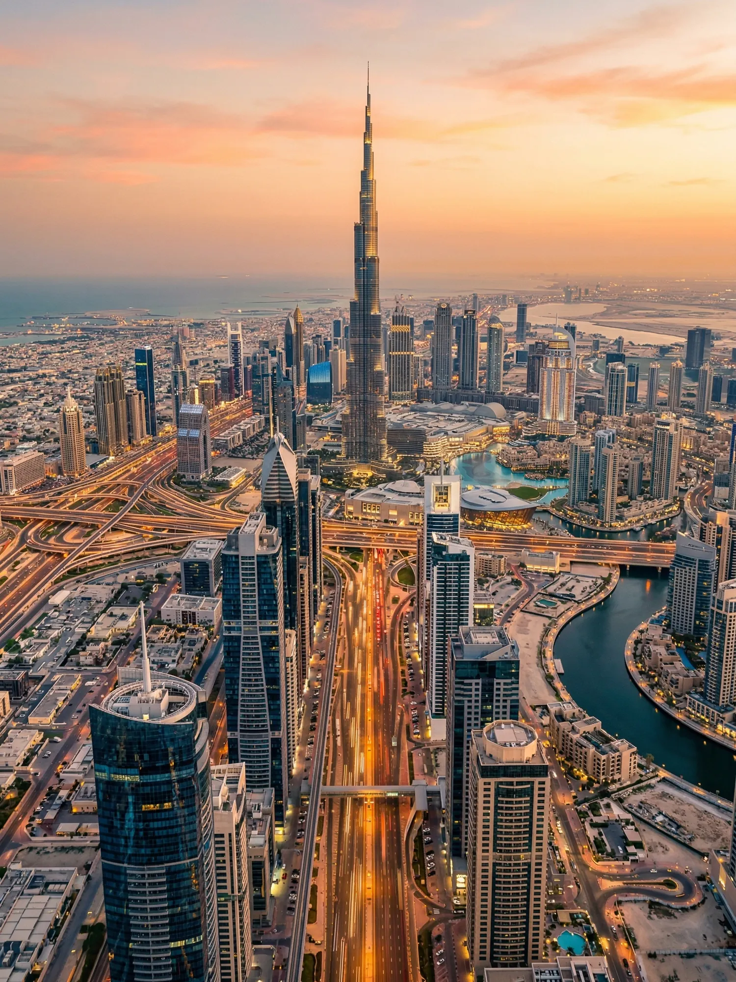 Panoramic aerial view of Dubai skyline at golden hour