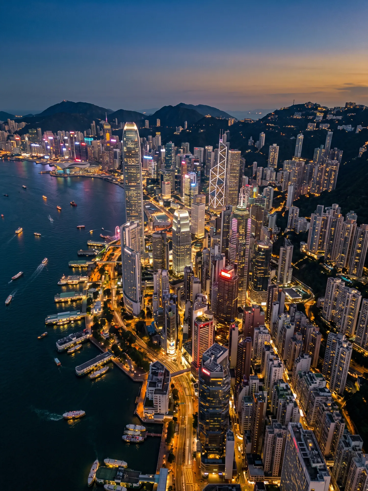 Panoramic aerial view of Hong Kong skyline at golden hour