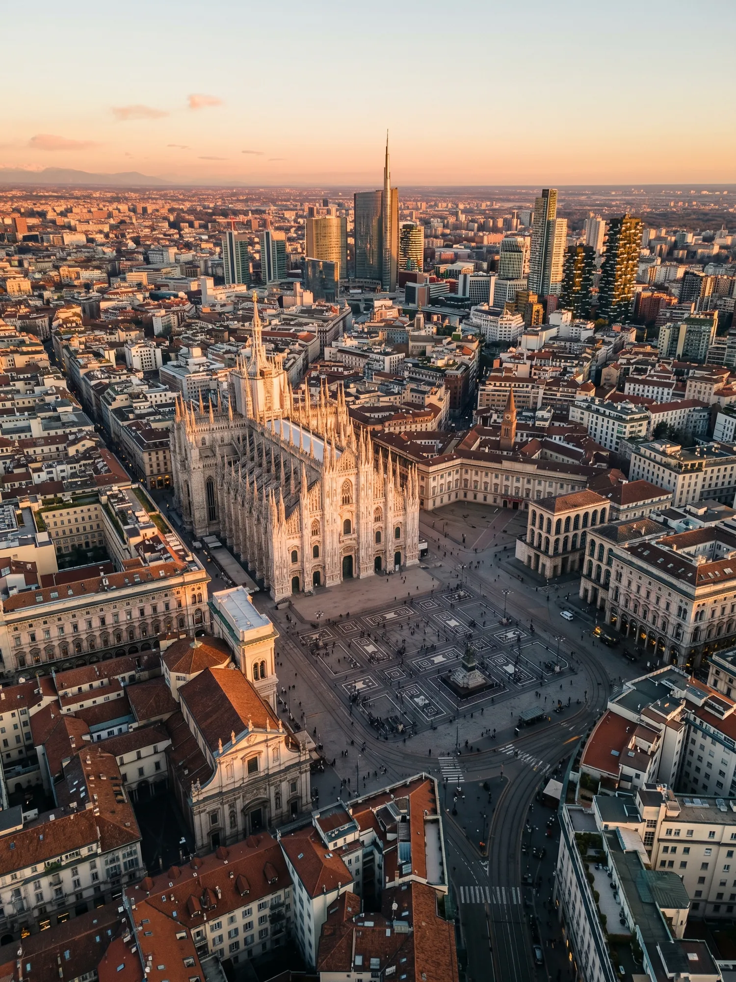 Panoramic aerial view of Milan skyline at golden hour