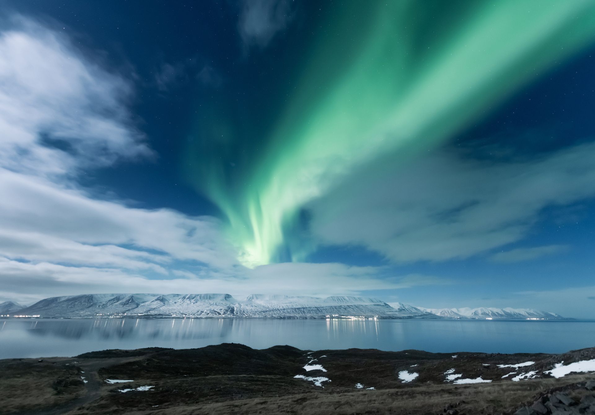 Image of Northern Lights Aurora Borealis Over Akureyri City In Iceland