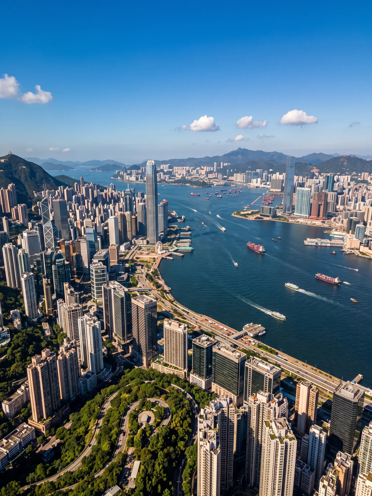 Panoramic aerial view of Hong Kong skyline in bright daylight